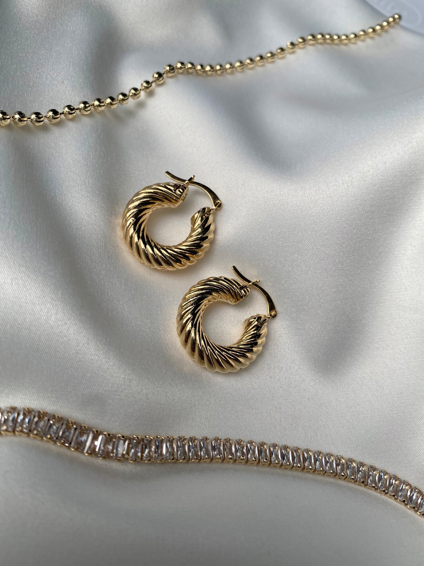 TWISTED LITTLE GOLD HOOPS